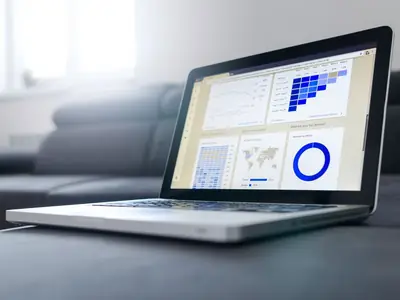 Laptop displaying analytics charts in a bright room