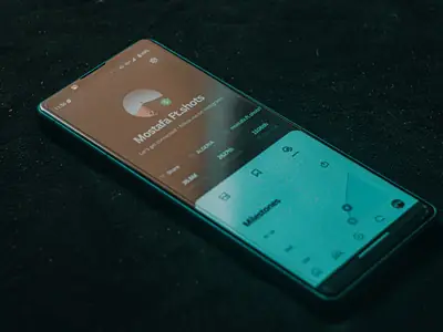 Smartphone showing an app interface on a dark surface